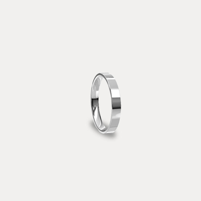 Anillo de matrimonio clásico plano en oro blanco