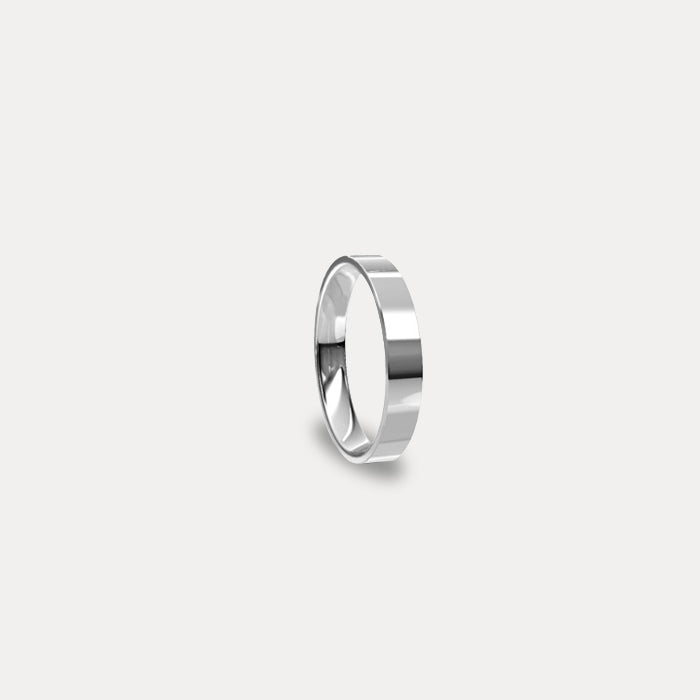 Anillo de matrimonio clásico plano en oro blanco