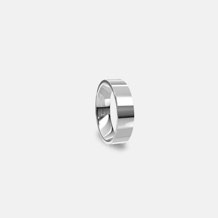Anillo de matrimonio clásico plano en oro blanco