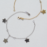Pulsera en oro blanco con dijes de estrellas
